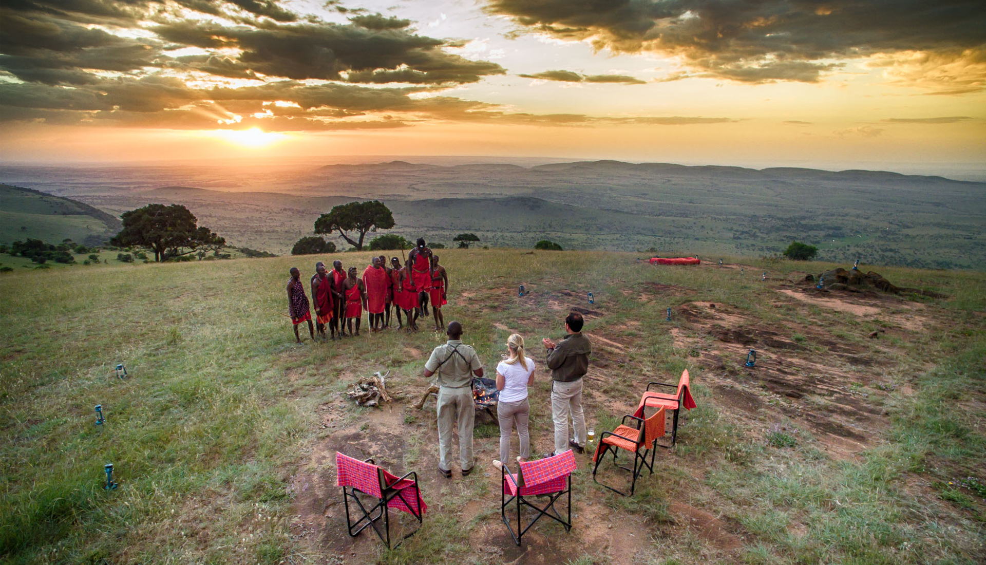 andBeyond_Kleins-Camp_masai-warriors-sundowner_Serengeti_Tanzania_Destination